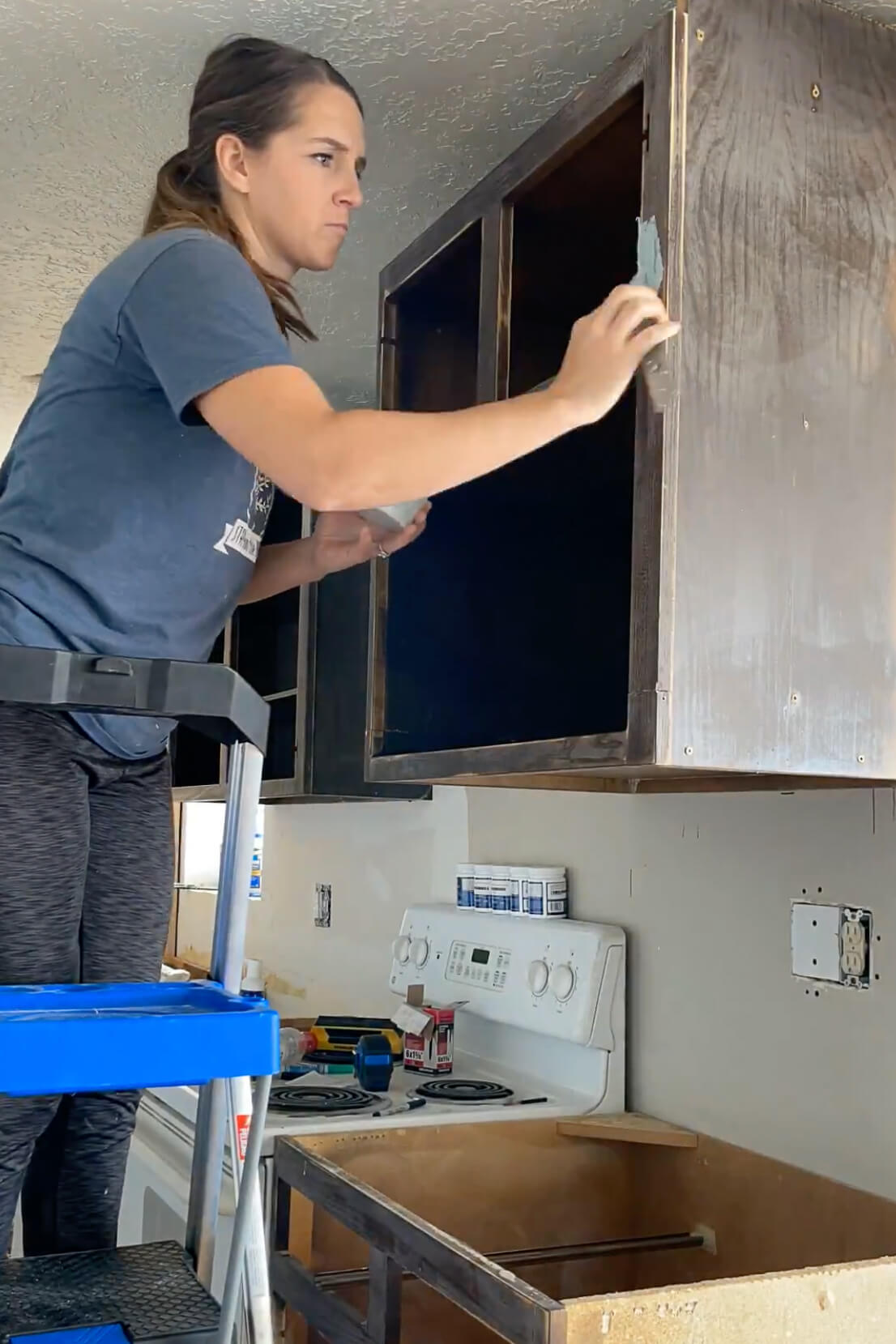 Patching cabinets with bondo.